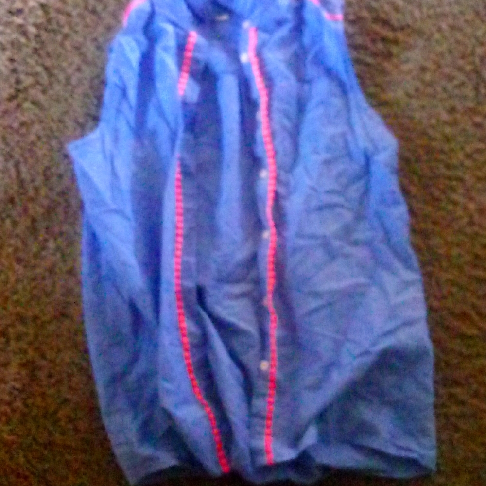 Super cute sweater thing and bluish and has a little hot pink